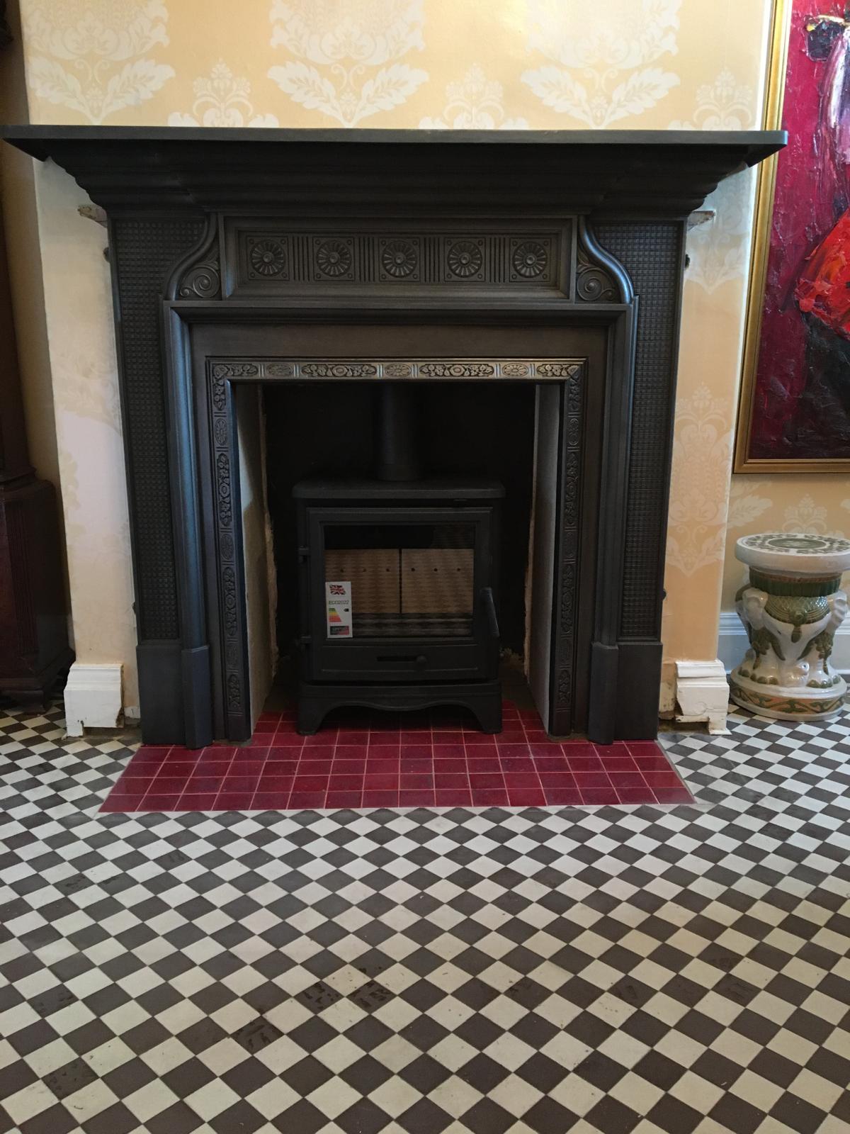 Cast iron fireplace surround with tiled hearth