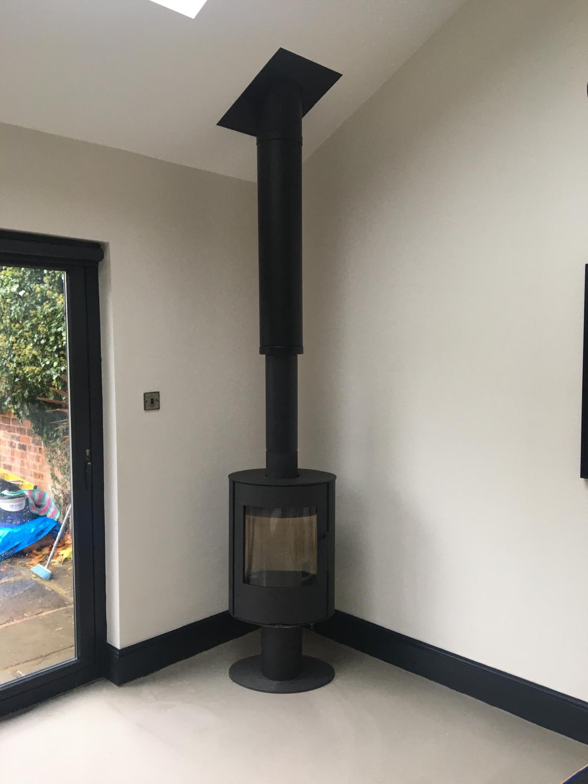 Modern corner pedestal stove installation